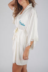 It’s a Boy satin robe in pink with line details 